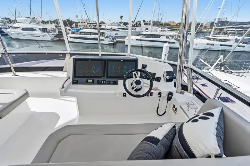 Slide: The Image of Luxurious 2025 Leopard 53 Powercat yacht deck with ocean view and modern seating. - 37