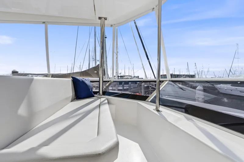 Slide: The Image of 2025 Leopard 53 Powercat yacht docked in marina, featuring spacious deck and modern design. - 40