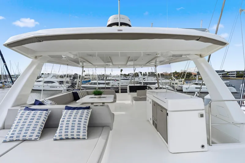 Slide: The Image of 2025 Leopard 53 Powercat helm with modern controls and ocean view. - 45