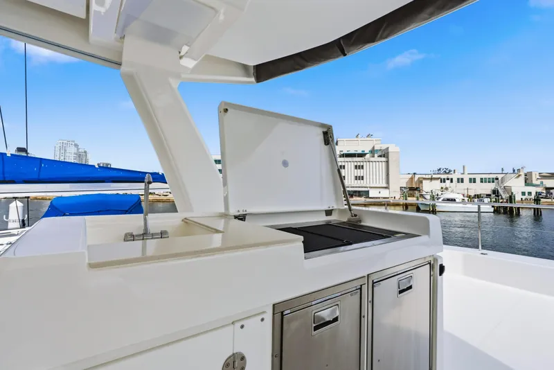 Slide: The Image of 2025 Leopard 53 Powercat helm with modern navigation system, overlooking the ocean. - 47