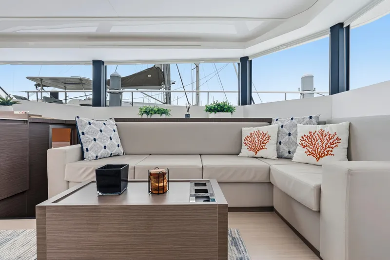 Slide: The Image of 2025 Leopard 53 Powercat cruising on open sea under clear blue sky. - 5