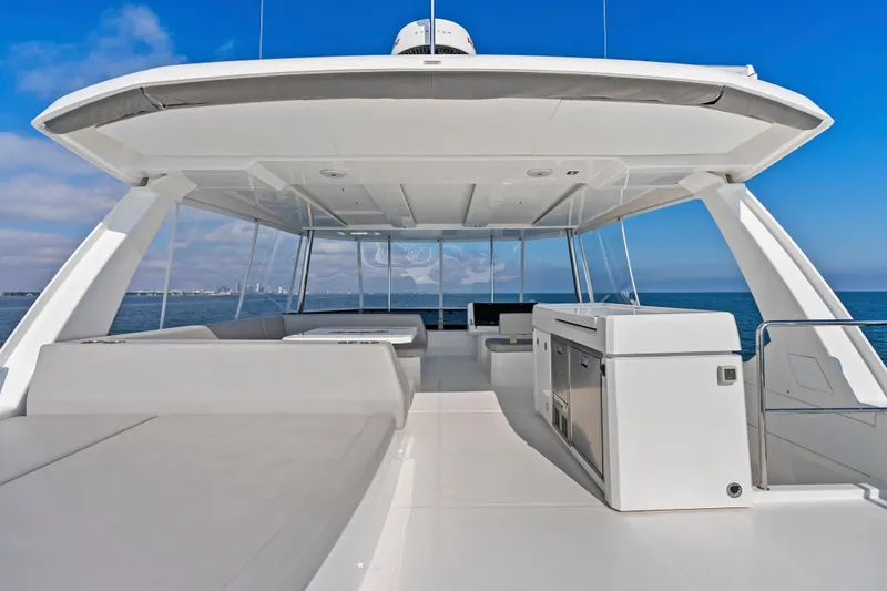 Slide: The Image of 2025 Leopard 53 Powercat yacht deck with modern seating and ocean view. - 51