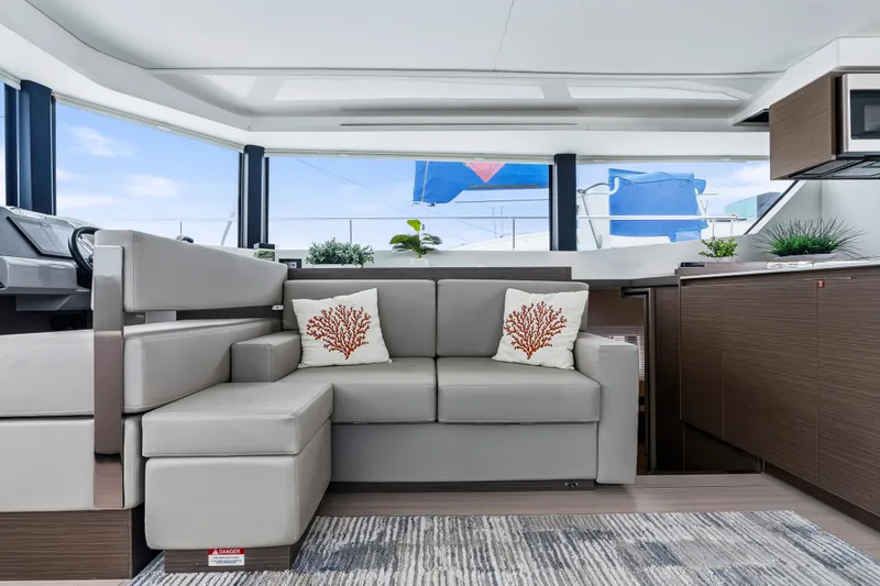 Slide: The Image of Aerial view of 2025 Leopard 53 Powercat cruising on green water. - 8