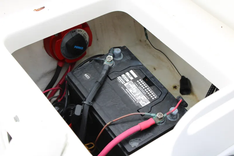Slide: The Image of Battery compartment of 2005 Edgewater 185DC boat with Perko switch visible. - 27
