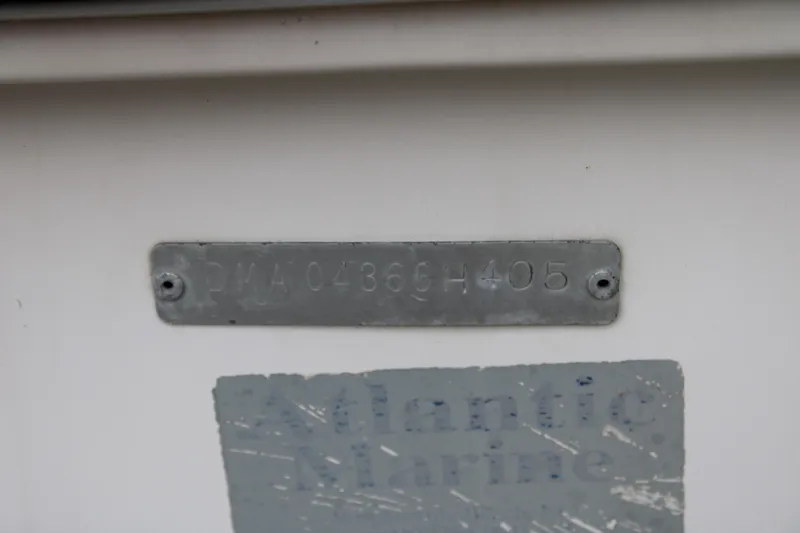 Slide: The Image of 2005 Edgewater 185DC boat identification plate with serial number and Atlantic Marine label. - 28