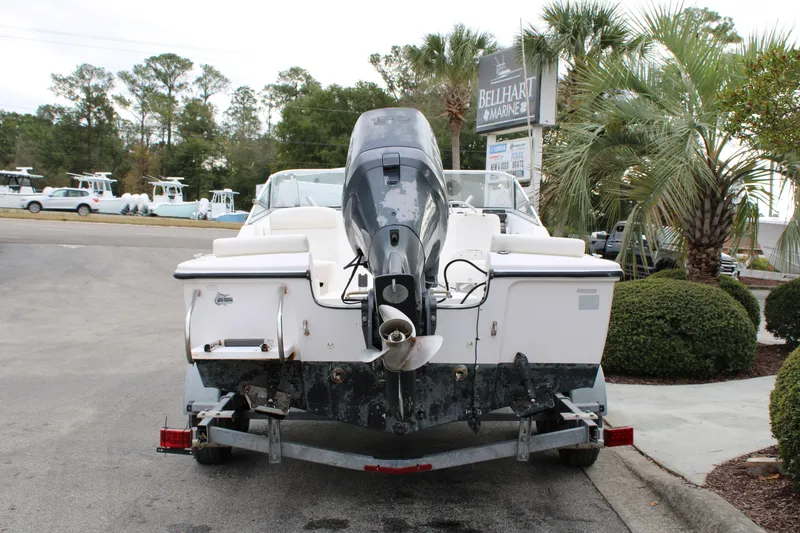 Slide: The Image of Rear view of a 2005 Edgewater 185DC boat on a trailer at a marine dealership. - 6
