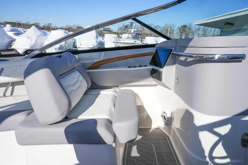 Slide: The Image of Interior of 2026 Regal LX9 boat with modern seating and dashboard. - 16