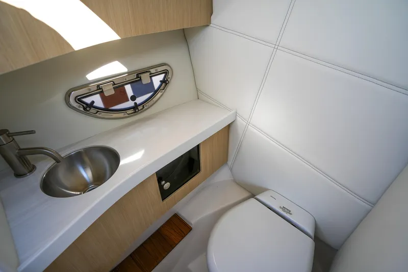 Slide: The Image of Luxurious 2026 Regal LX9 boat bathroom with modern sink and toilet design. - 18