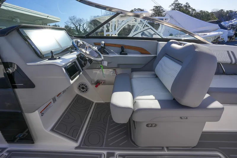 Slide: The Image of 2026 Regal LX9 boat interior with modern dashboard and comfortable seating. - 19