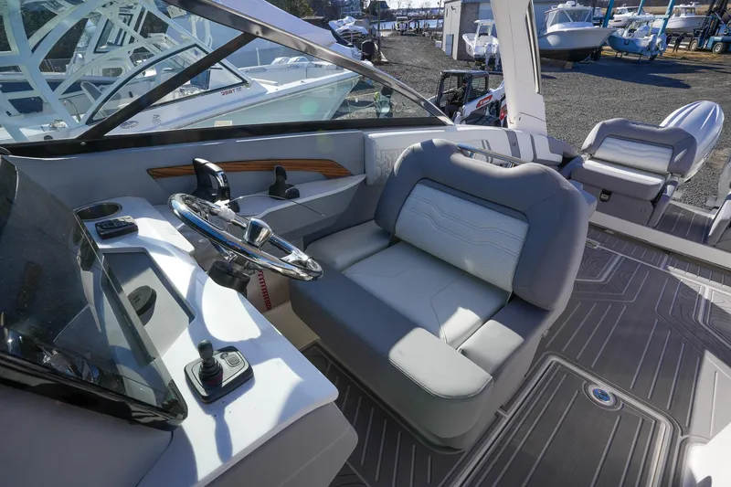 Slide: The Image of Luxurious 2026 Regal LX9 boat interior with modern steering and comfortable seating. - 26