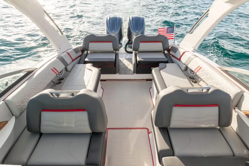 Slide: The Image of Manufacturer Provided Image: Luxurious 2026 Regal LX9 boat interior with plush seating and dual engines on open water. - 8