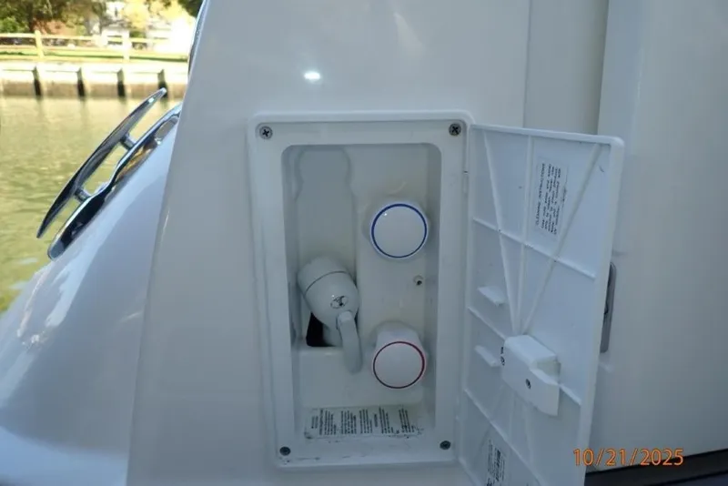 Slide: The Image of Modern kitchenette in 2021 Monterey 295 Sport Yacht with stove, sink, and microwave. - 10