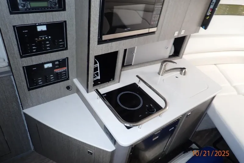 Slide: The Image of Interior seating of 2021 Monterey 295 Sport Yacht, featuring white cushioned upholstery. - 11