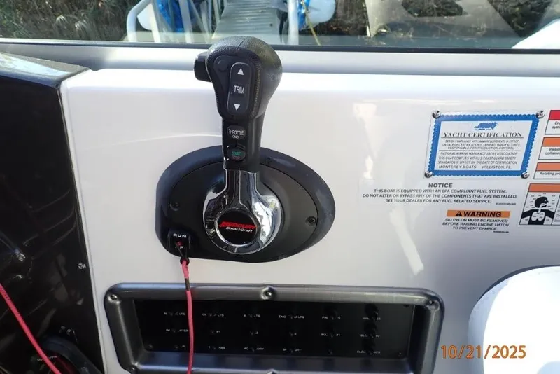 Slide: The Image of 2021 Monterey 295 Sport Yacht engine compartment with hydraulic lift and circular access panel. - 8