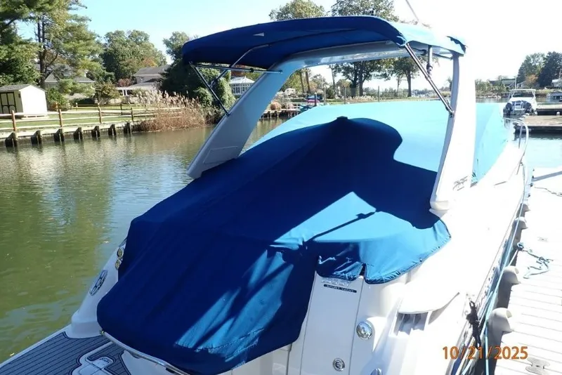 Slide: The Image of Interior of 2021 Monterey 295 Sport Yacht with modern seating and kitchenette. - 19