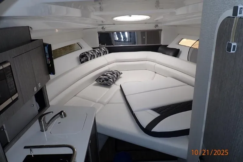 Slide: The Image of 2021 Monterey 295 Sport Yacht interior with control panel and sleek design. - 20