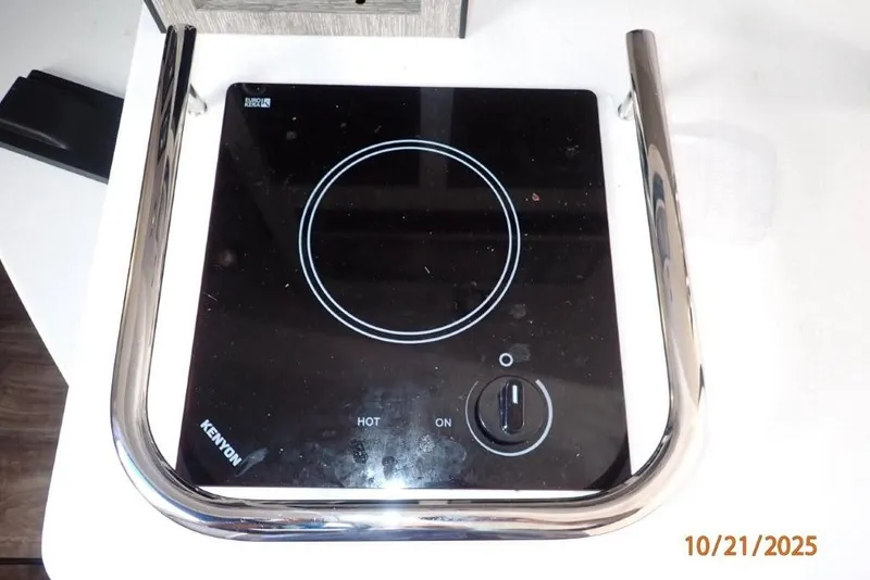 Slide: The Image of Stainless steel door inside 2021 Monterey 295 Sport Yacht, featuring modern design and wood flooring. - 4