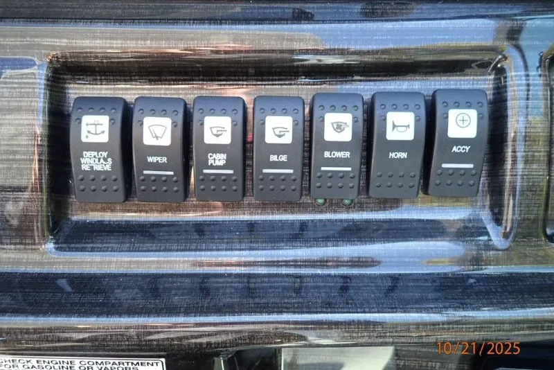 Slide: The Image of Control panel of a 2021 Monterey 295 Sport Yacht with throttle and certification labels. - 7