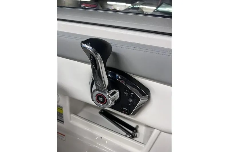 Slide: The Image of Throttle control of 2025 Chaparral 23 SSi boat, featuring sleek design and modern technology. - 12