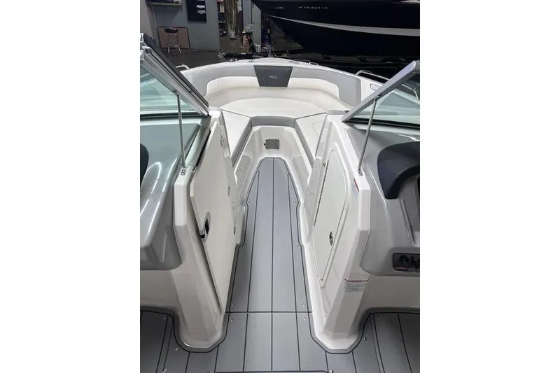 Slide: The Image of 2025 Chaparral 23 SSi boat interior with sleek seating and modern design. - 13