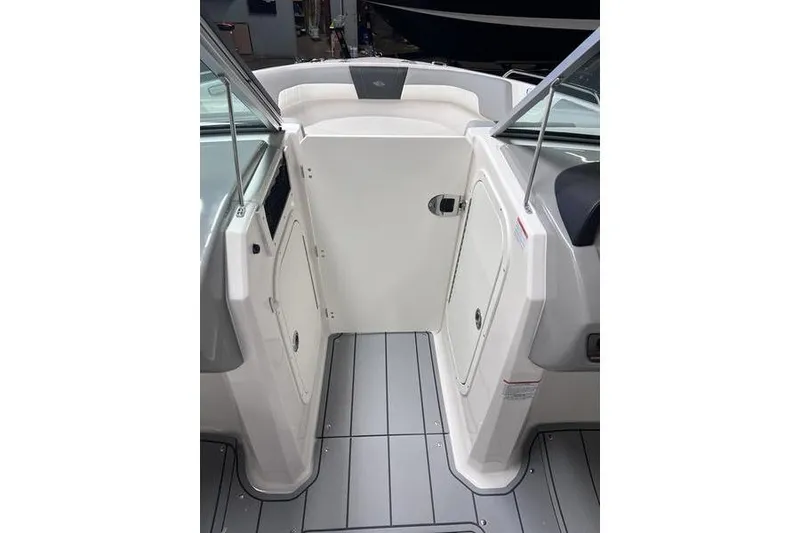 Slide: The Image of 2025 Chaparral 23 SSi boat interior with sleek design and modern features. - 14
