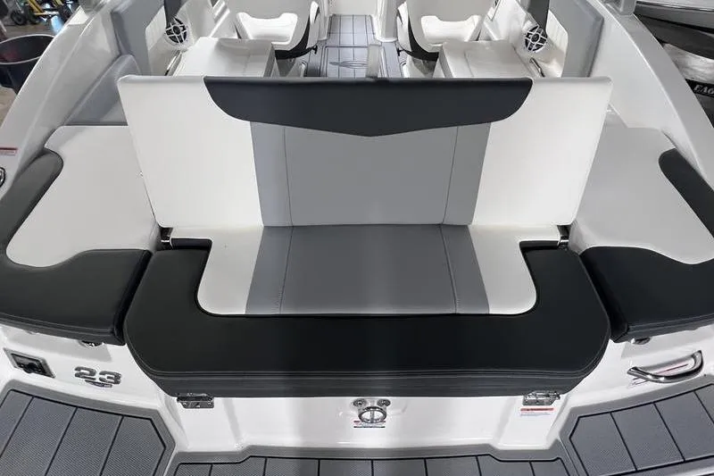 Slide: The Image of 2025 Chaparral 23 SSi boat interior with sleek seating and modern design. - 22
