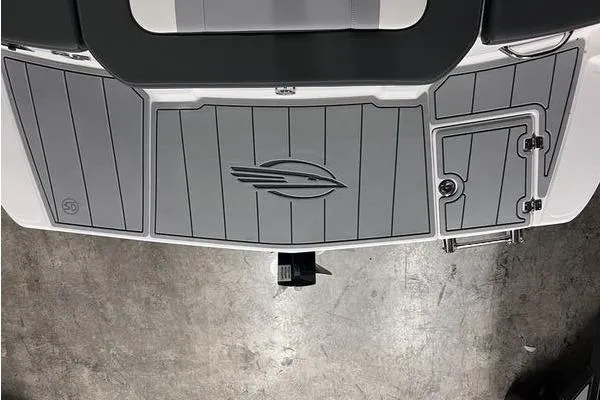 Slide: The Image of 2025 Chaparral 23 SSi boat deck with logo, featuring sleek gray design. - 24