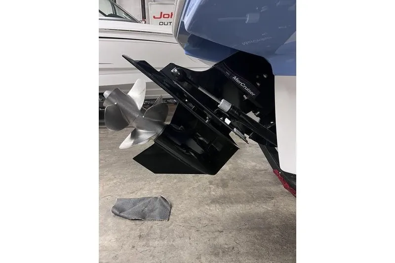 Slide: The Image of 2025 Chaparral 23 SSi boat with MerCruiser outdrive and stainless steel propeller. - 25