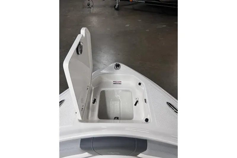 Slide: The Image of Open storage compartment on 2025 Chaparral 23 SSi boat, showcasing interior space. - 4