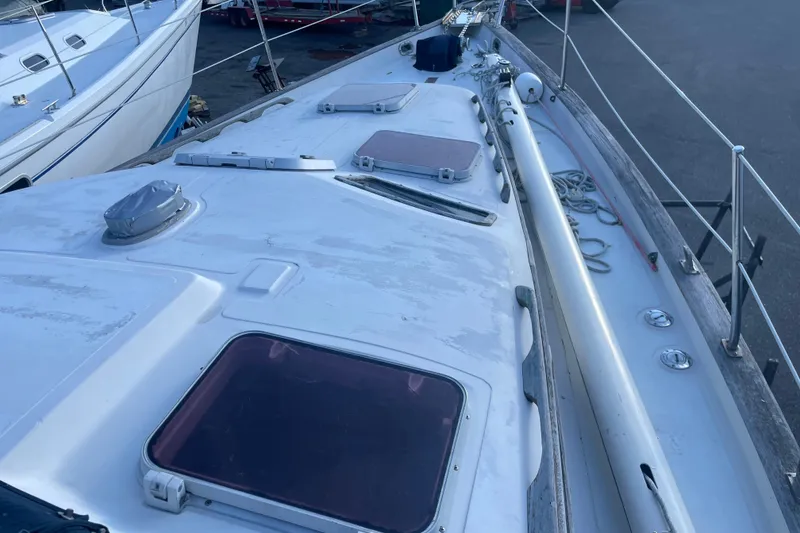 Slide: The Image of 1987 Irwin 38 Mk II sailboat deck with hatches and rigging. - 12