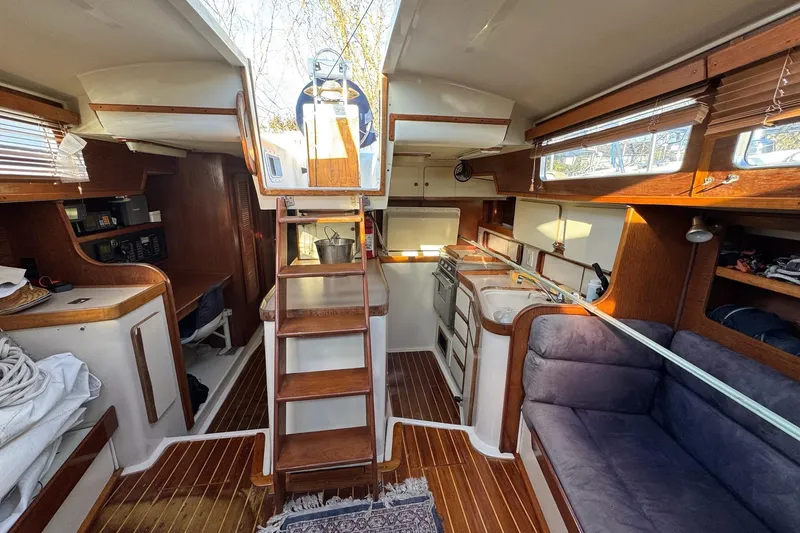 Slide: The Image of Interior of 1987 Irwin 38 Mk II sailboat with wood finishes and cozy seating. - 16