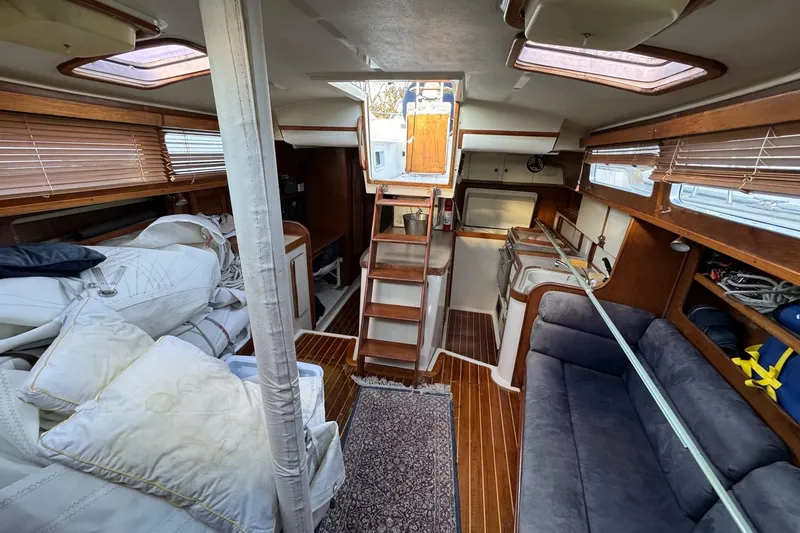 Slide: The Image of Interior of 1987 Irwin 38 Mk II sailboat with cozy seating and wooden finishes. - 18