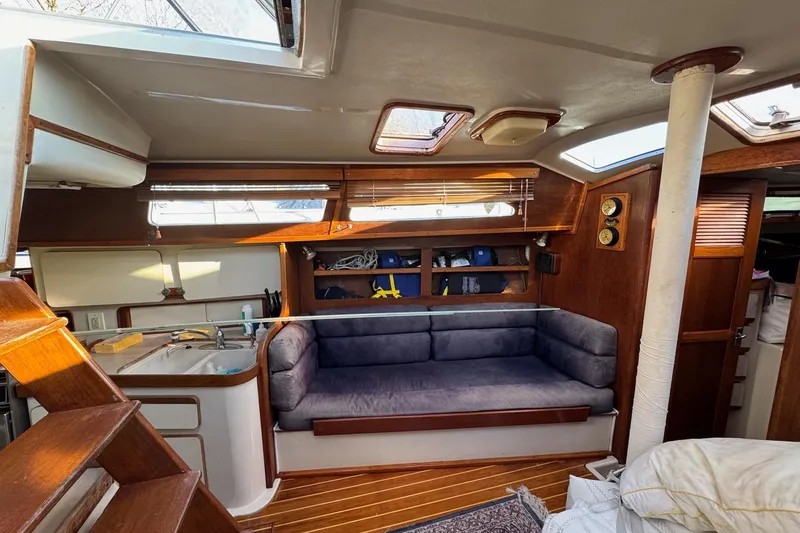 Slide: The Image of Interior of 1987 Irwin 38 Mk II sailboat with cozy seating and wooden accents. - 19