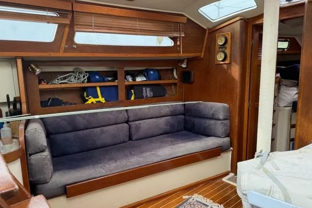 Slide: The Image of Interior of 1987 Irwin 38 Mk II sailboat with cozy seating and wooden accents. - 20