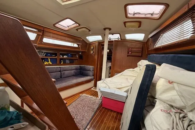 Slide: The Image of Interior of 1987 Irwin 38 Mk II sailboat with wooden finishes and seating area. - 26