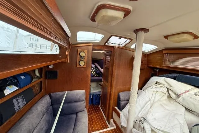 Slide: The Image of Interior of 1987 Irwin 38 Mk II sailboat with wood finish and cozy seating. - 27