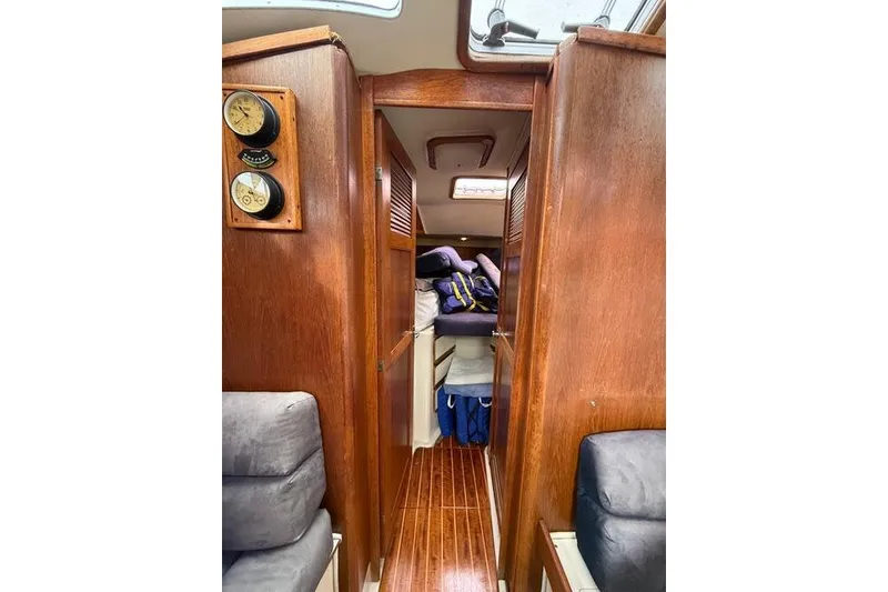 Slide: The Image of Interior of 1987 Irwin 38 Mk II sailboat with wooden paneling and cozy cabin space. - 30
