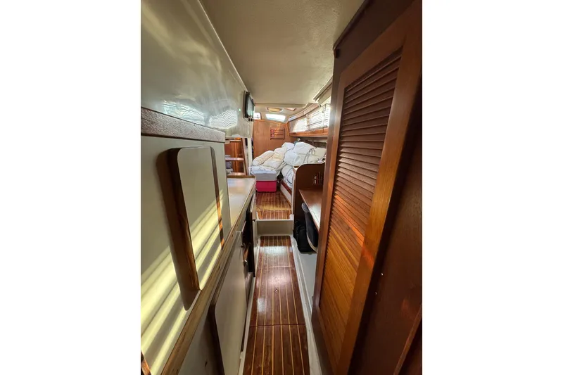 Slide: The Image of Interior of 1987 Irwin 38 Mk II sailboat with wooden finishes and cozy cabin space. - 31