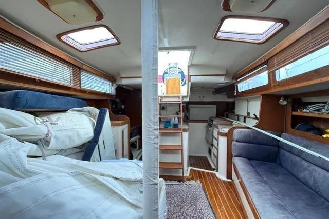 Slide: The Image of Interior of 1987 Irwin 38 Mk II sailboat with cozy seating and wooden accents. - 32
