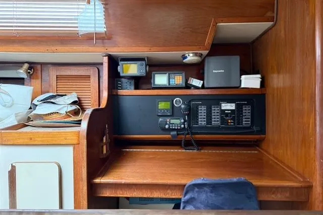 Slide: The Image of Navigation station of 1987 Irwin 38 Mk II sailboat with control panel and equipment. - 36