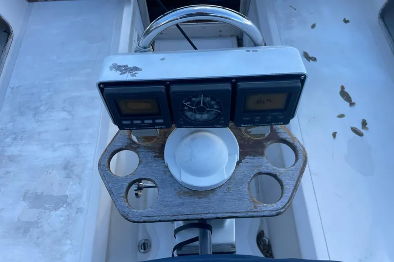 Slide: The Image of Cockpit instruments of a 1987 Irwin 38 Mk II sailboat, featuring depth and speed gauges. - 7