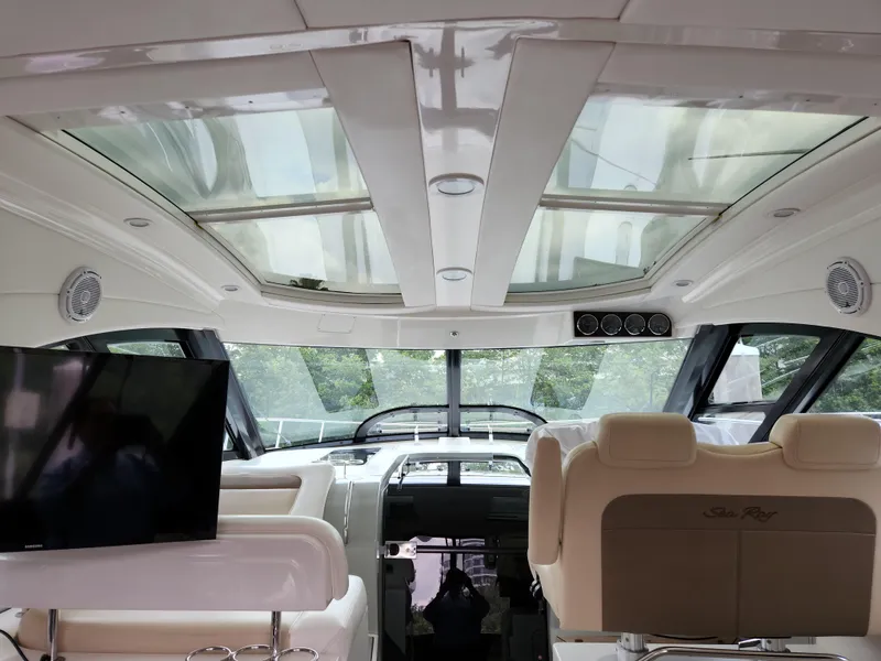 Slide: The Image of Interior view of 2014 Sea Ray 470 Sundancer yacht with luxurious seating and panoramic windows. - 19