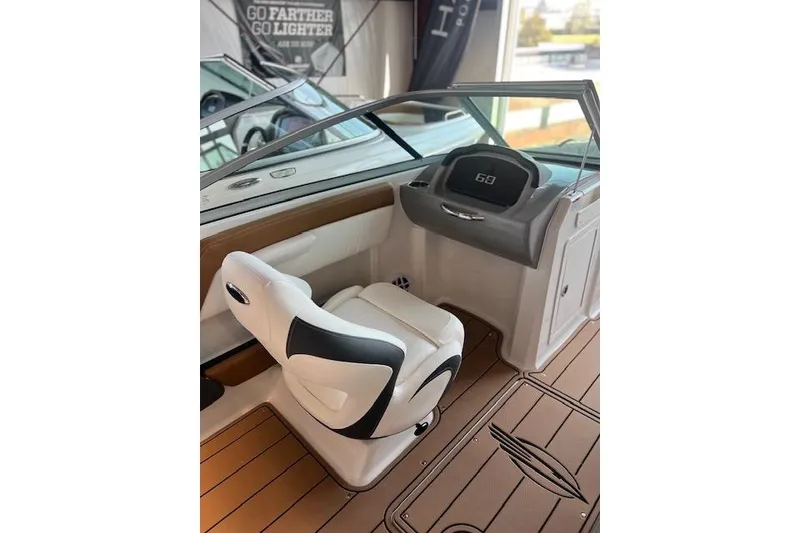 Slide: The Image of 2025 Chaparral 21 SSi boat interior with sleek helm and comfortable seating. - 11