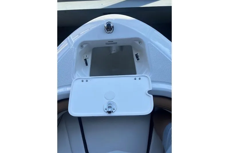 Slide: The Image of 2025 Chaparral 21 SSi boat storage compartment with open hatch. - 3