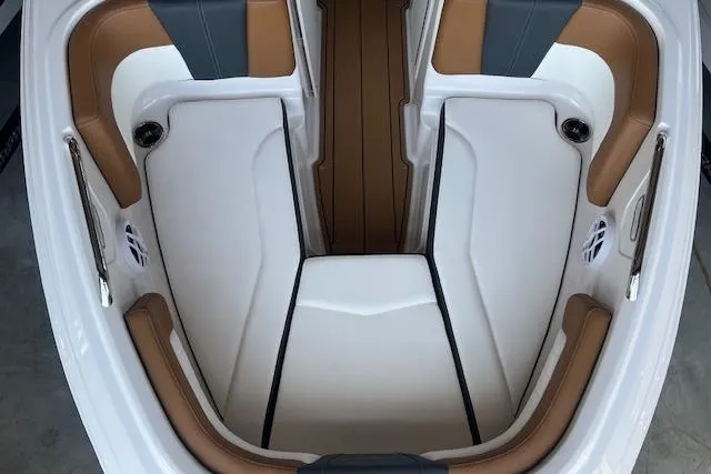 Slide: The Image of 2025 Chaparral 21 SSi boat interior with white and brown seating. - 4