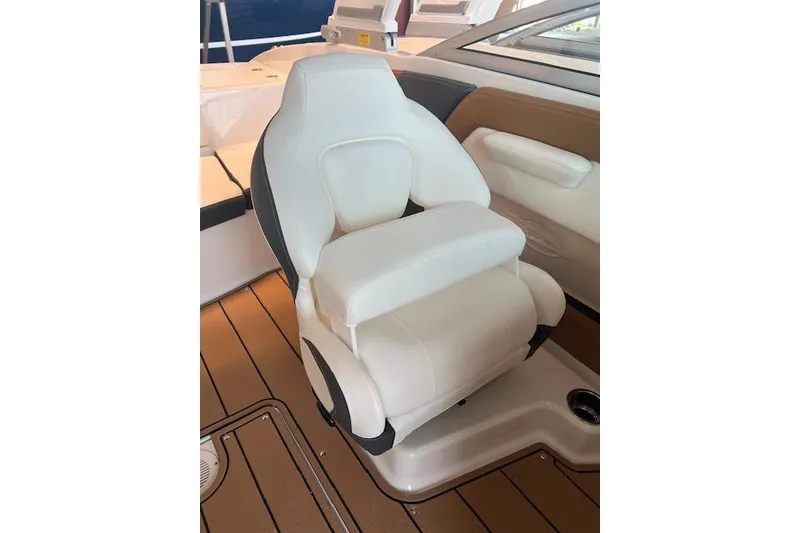 Slide: The Image of 2025 Chaparral 21 SSi boat seat, white leather, modern design, on teak deck. - 7