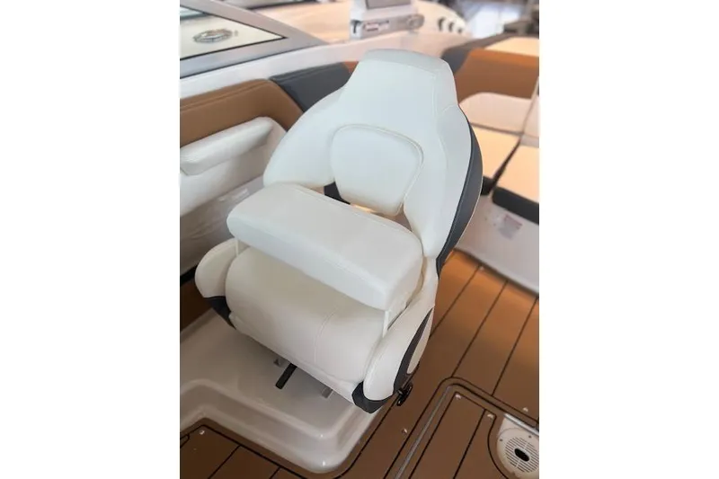 Slide: The Image of 2025 Chaparral 21 SSi boat seat, white leather, modern design, on teak deck. - 9