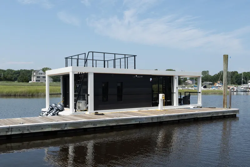The Image of Modern Waterlodge 11 houseboat docked on a serene river, 2025 model. - 0