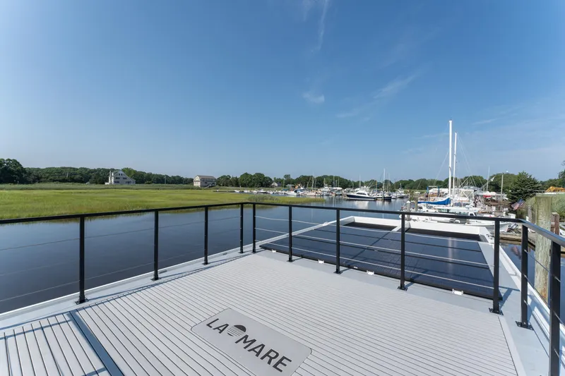 Slide: The Image of Modern Waterlodge 11 houseboat with spacious deck overlooking marina and lush greenery, 2025 model. - 24