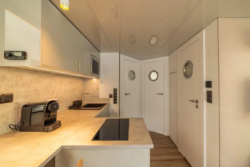 Slide: The Image of Modern kitchen interior in Waterlodge Modern 11, 2026 model, featuring sleek appliances and minimalist design. - 36